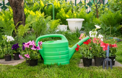 Garden worker wearing PPE while carrying out maintenance